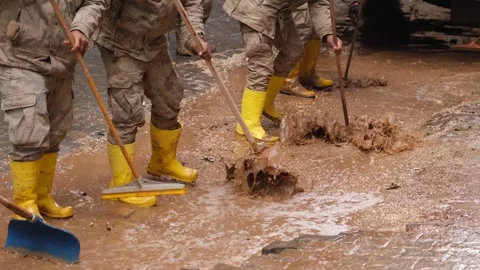 Workers clean the streets after the flood 3 Stock Footage 294085501