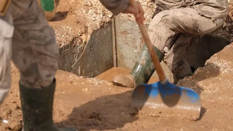 Workers clean the streets after the flood 2 Stock Footage 294085565