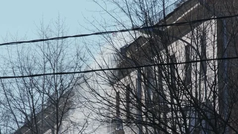 Workers cleaning and dumping snow and ice from roofs in the city. Winter city Stock-Footage 155795673