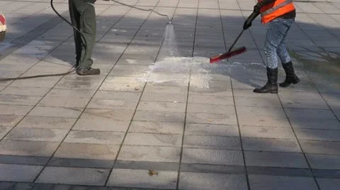 Workers cleaning city square  pavement Stock Footage 12354439