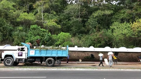 Workers cleaning main roads during the recovery of the Central University in Stock Footage 167867492