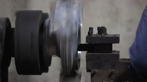 Workers a cleaning a metal casting part in factory. Industrial safety first Stock Footage 296808367