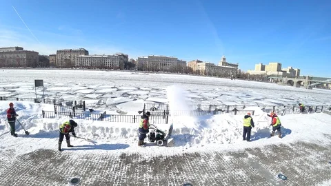 Workers cleaning the snow in the winter city Stock Footage 87267021