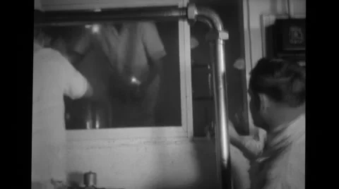 Workers cleaning windows at the Blue Seal Dairy plant Stock Footage