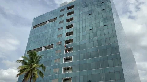 Workers cleaning windows service on high rise building, building glass cleaning Video stock 159977997