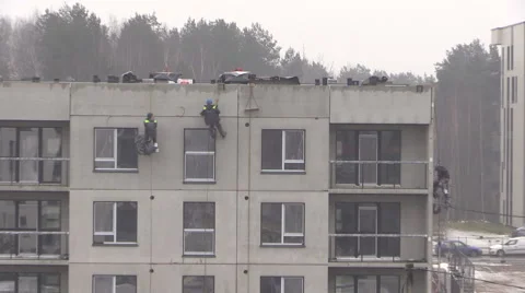 Workers climbers work on new build house wall. Zoom in Stock Footage 52883594