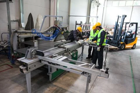 Workers at CNC machine shop Stock Photos