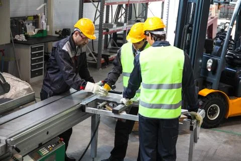 Workers at CNC machine shop Stock Photos