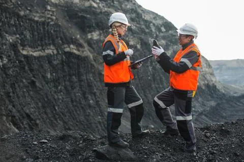 Workers with coal at open pit Stock Photos