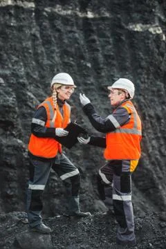 Workers with coal at open pit Stock Photos
