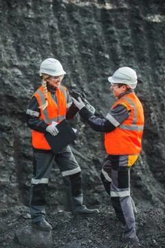 Workers with coal at open pit Stock Photos