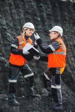 Workers with coal at open pit Stock Photos