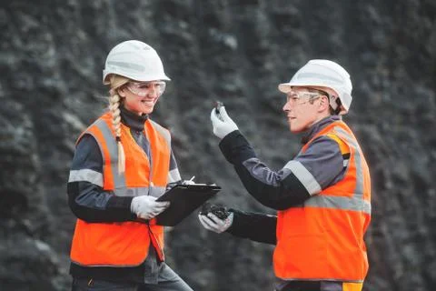 Workers with coal at open pit Stock Photos