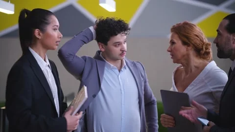 Workers, colleagues in office discussing work issues, annoyed, quarreling Stock Footage 233717183