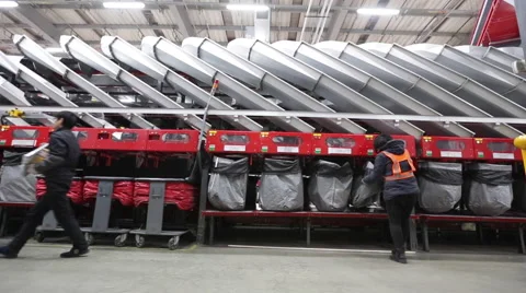 Workers collecting mails and packages at an express company Stock Footage 46494991