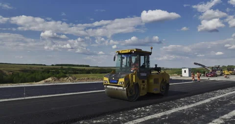 Workers completes construction of highway using equipment Stock-Footage 253418563