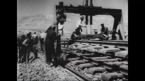 Workers conduct construction of Tehran-Tabriz Railway, Iranian train lines -1958 Stock Footage 109414190