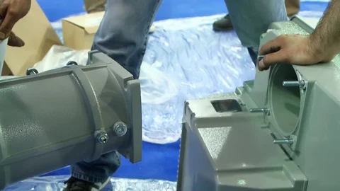 Workers connecting machine together Stock-Footage 128929408