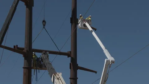 Workers construct Electric Grid c, 4K. Stock Footage 246976283