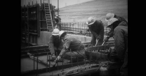 Workers constructing a dam Stock Footage 43393442