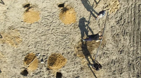 Workers constructing piling for a new house Stock Footage 63157627