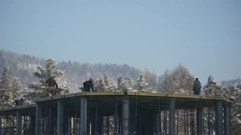 Workers on the construction of building in winter Stock Footage 18897396