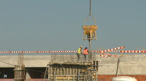 Workers in construction pouring  concrete Stock Footage 654140