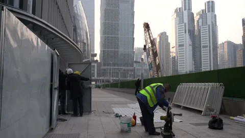 Workers at a construction site in Beijing's central business area Stock Footage 234315452