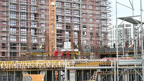 Workers at the construction site. Building under construction. Stock Footage 301377710