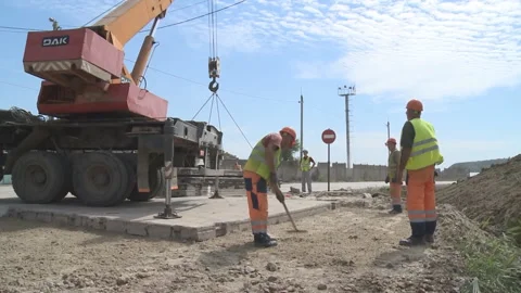 Workers at the construction site. Construction of a reinforced concrete building Stock Footage 104194914