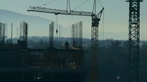 Workers on the construction site early in the morning Stock Footage