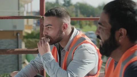 Workers In Construction Site Eating Lunch And Having Fun Stock Footage 98289588