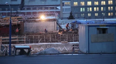 Workers at a construction site in the evening in the Russian city Stock Footage 60227278