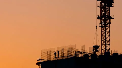 Workers at the construction site knit rebar.  Stock Footage 164338306