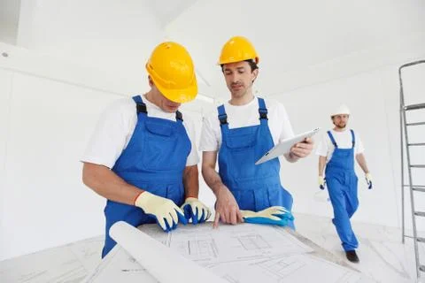 Workers at construction site Stock Photos