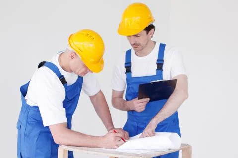 Workers at construction site Stock Photos