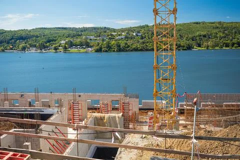 Workers at the construction site. Structural steel beam to build a large Stock Photos