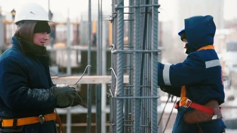 Workers at the construction site weaves the armature Stock Footage 82136402
