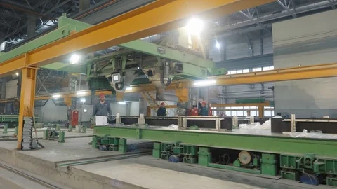 Workers control concrete construction panels production Stock Footage 124299224