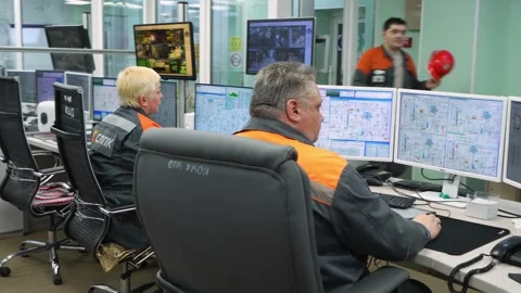 Workers at the control panel in production Stockbeeldmateriaal 294972365