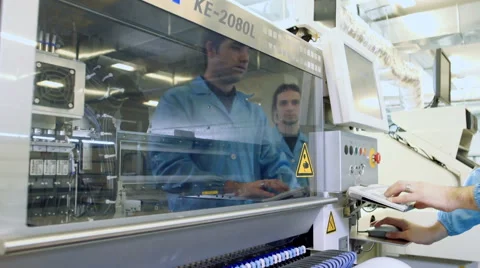Workers controlling quality of PCB boards Stock Footage 50304402