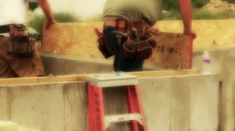 Workers contructing house Stock Footage