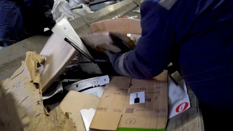 Workers on the conveyor of the waste processing plant. Recycling of garbage. Stock Footage 122709926