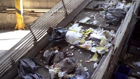 Workers on the conveyor of the waste processing plant Video stock 243888695