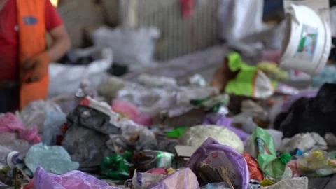 Workers on the conveyor of the waste processing plant Video stock 243888806