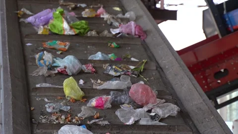 Workers on the conveyor of the waste processing plant Video stock 243888914