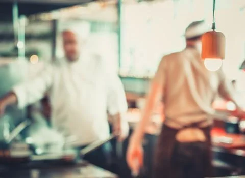 Workers Cooking in A Restuarant Stock-Fotos