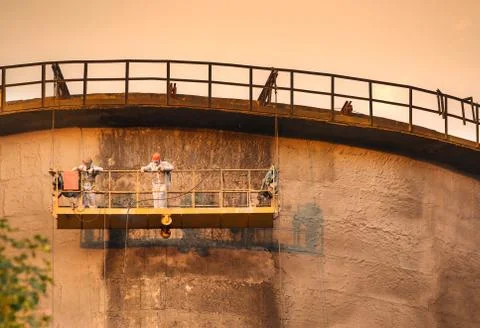 Workers on the cooling tower Stock Photos