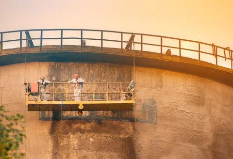 Workers on the cooling tower Stock Photos
