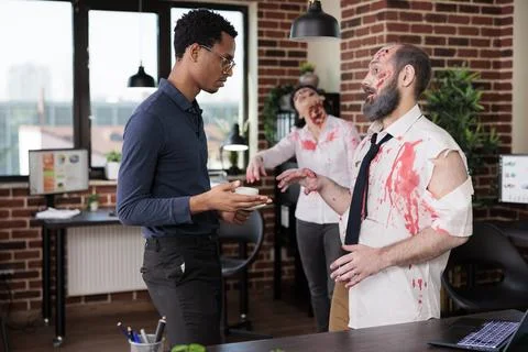Workers covered in scars exhausted after being overworked, talking with manager Stock Photos
